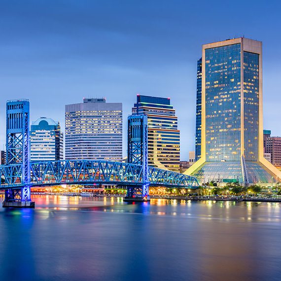 blue-lit-long-exposure-of-downtown-skyline-bridge-over-st-johns-river-jacksonville